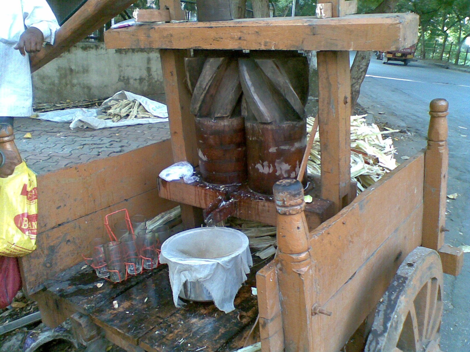 Sugarcane Juice Machine, completely made of wood except for nails and bearings extracts the sweetest juice I have ever tasted.